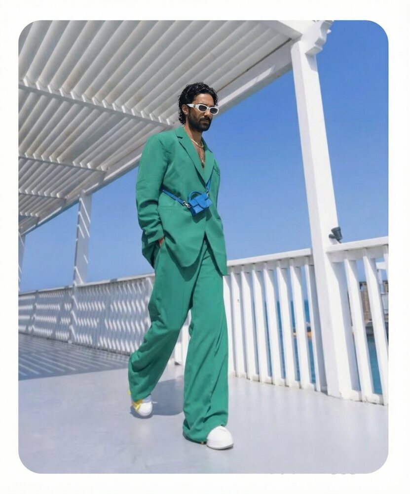 Amos Le Blanc, Canadian film director, green suit portrait on a deck