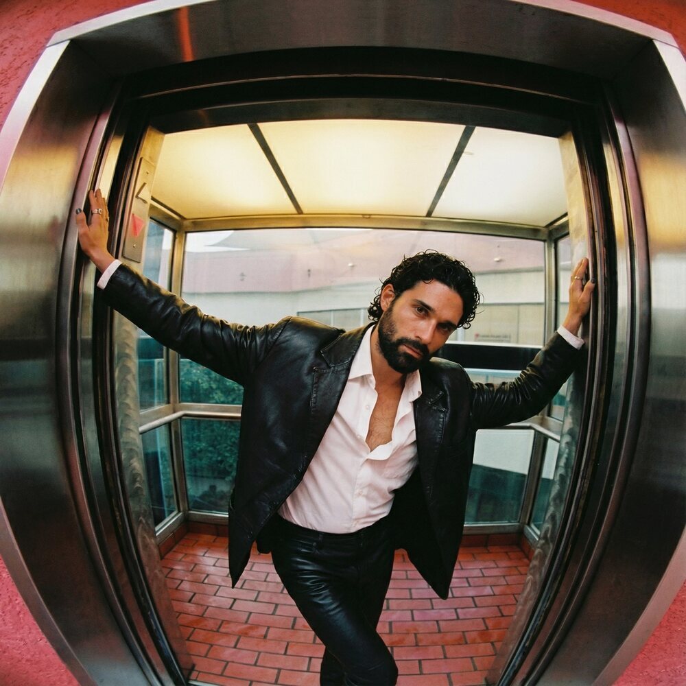 Amos Le Blanc, Canadian film director, leather jacket portrait in an elevator